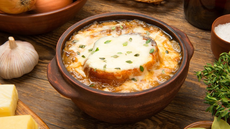 Bowl of French onion soup with melted cheese crouton