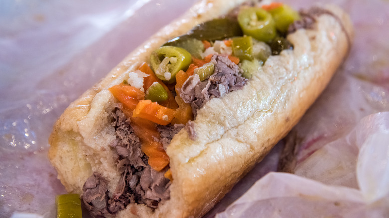 Italian beef sandwich topped with giardiniera