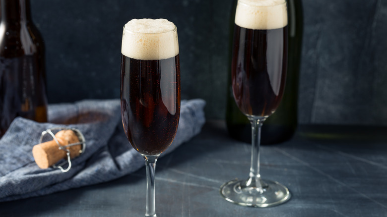 two glasses of champagne velvet on a table