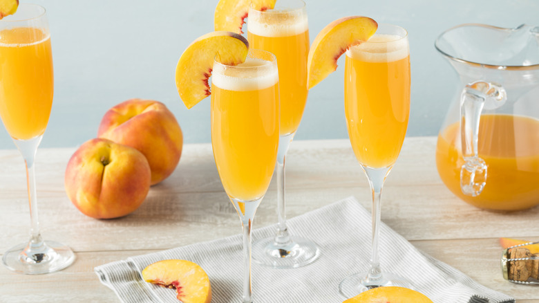 bellinis and peaches on a table