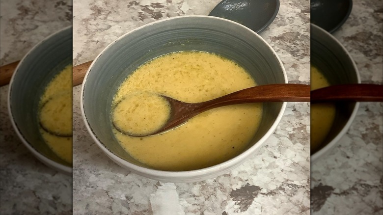 A bowl of soup that has broken