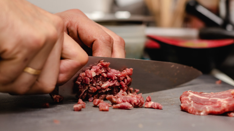 mincing beef for steak tartare