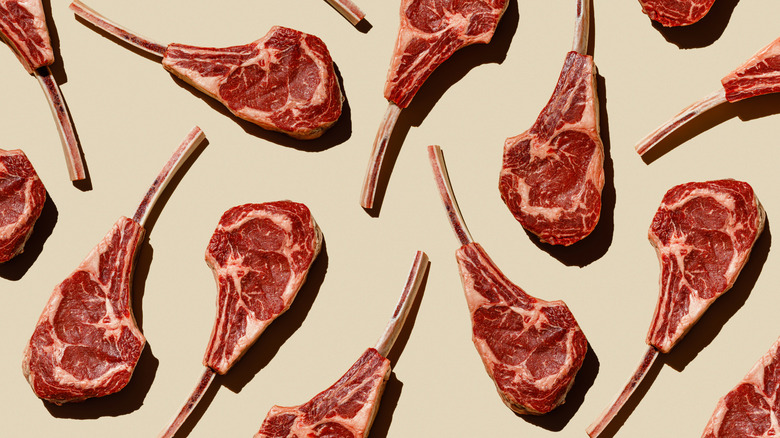 Tomahawk steaks on beige background