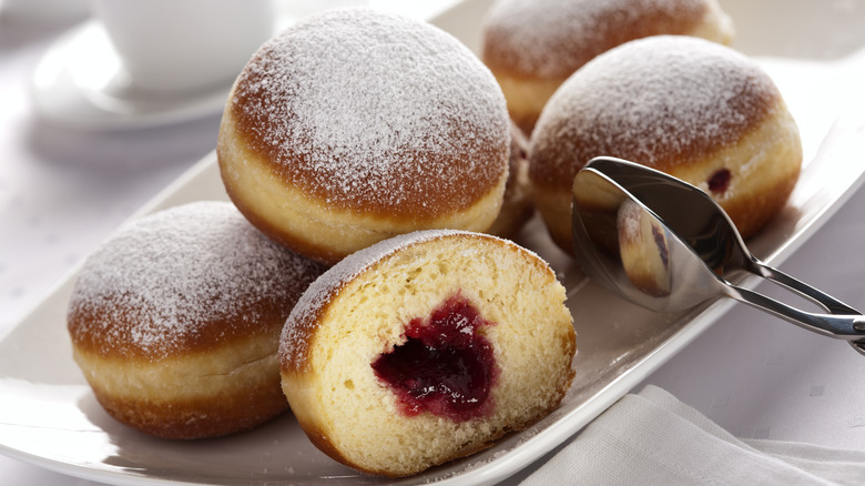 A plate of jelly-filled Bismark donuts