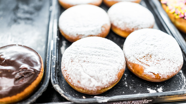 A tray of round Bismark donuts