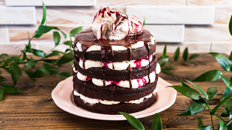 Black forest gâteau stacked with chocolate cake, whipped cream, chocolate ganache, and cherry jam