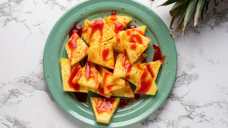 pineapple chunks drizzled with chamoy