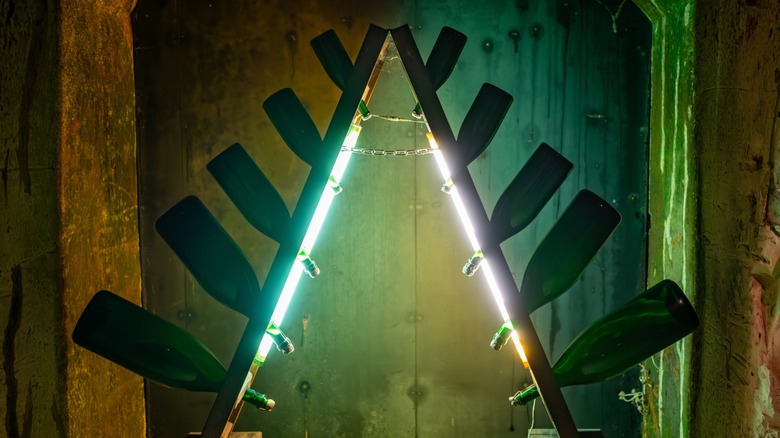 Champagne bottles fermenting on a wooden rack