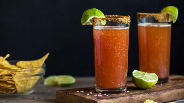Micheladas with salt rim and lime wedge