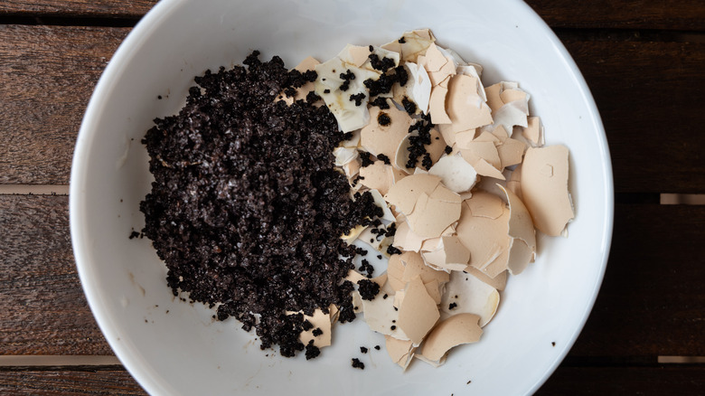 Coffee grounds and eggshells in bowl