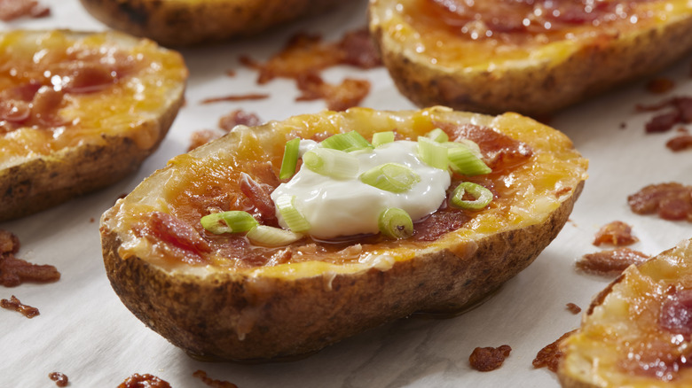 sour cream dolloped on loaded potato skins