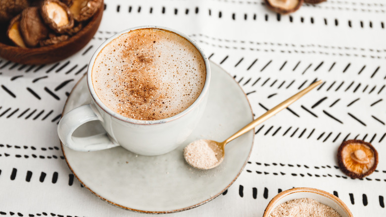 mushroom coffee latte on white tablecloth