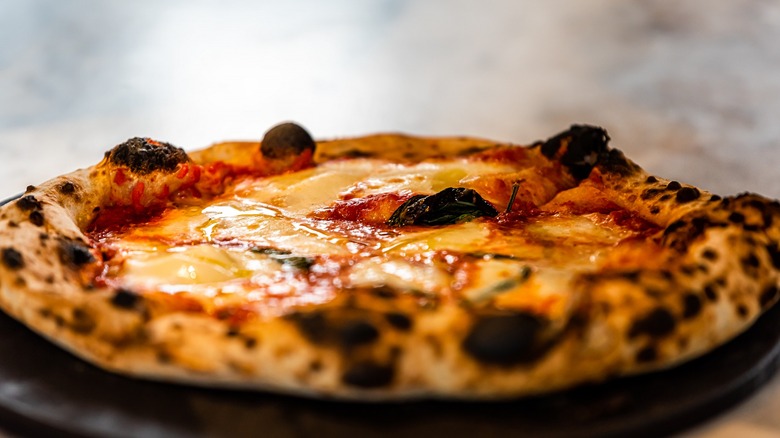 Pizza with charred crust