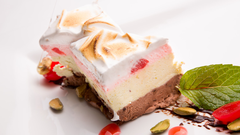 A slice of spumoni with nuts and meringue