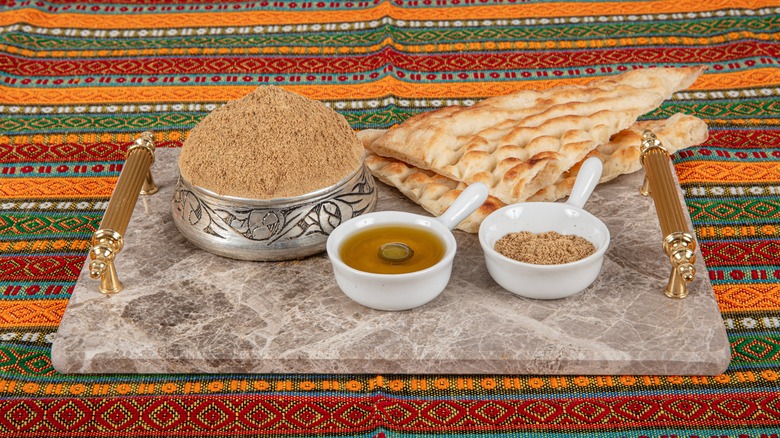 Za'atar, bread, and oil on a platter