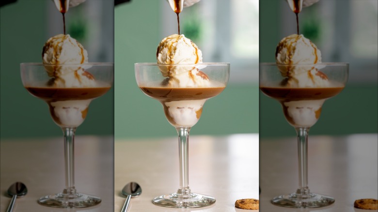 Espresso pouring over vanilla ice cream in cocktail glass