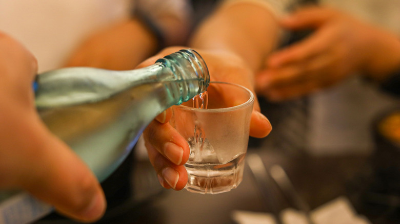 Chilled soju poured into a shot glass