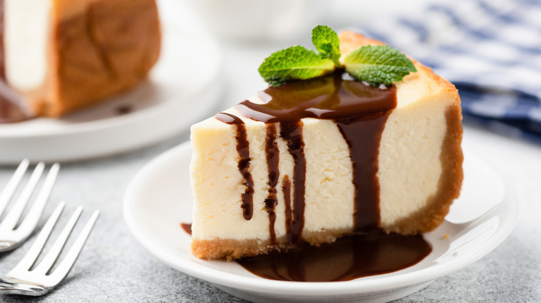 slice of cheesecake with chocolate drizzle