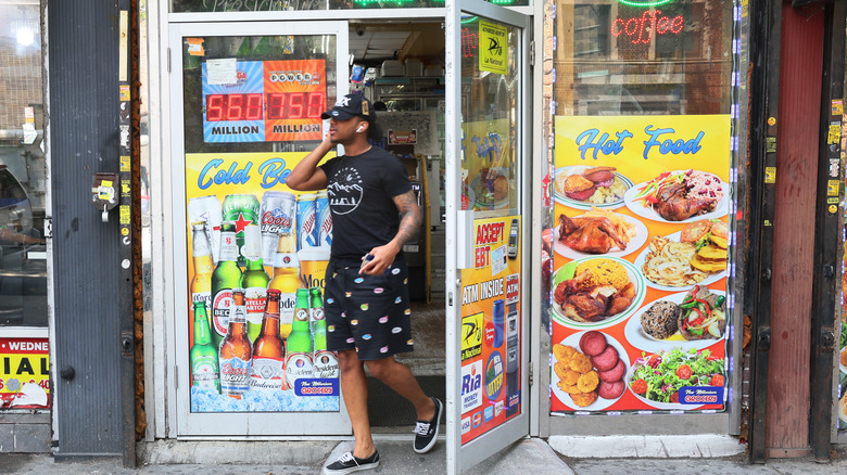 Man stepping out of bodega