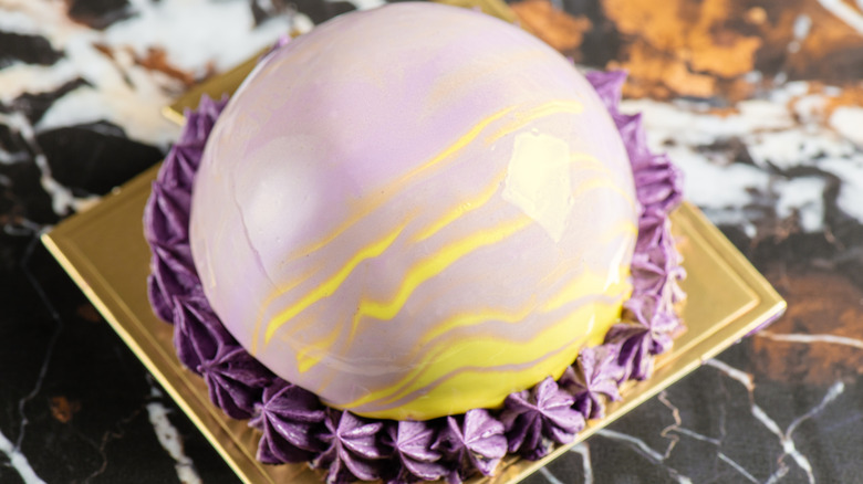 A yellow and purple ube entremet cake