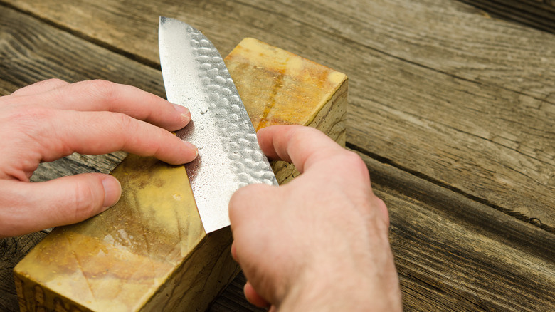 Sharpening Japanese knife on whetstone