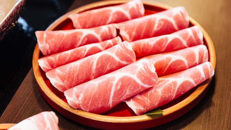 raw slices of kurobuta pork
