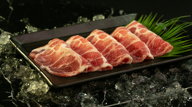 raw kurobuta pork black plate