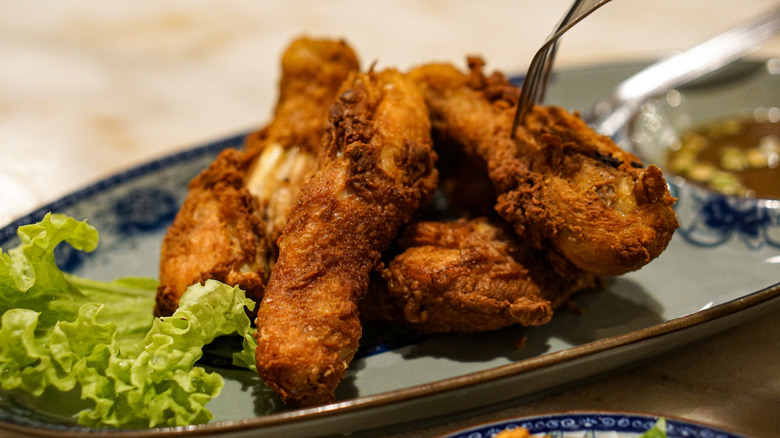 Malaysian fried chicken pieces on a plate