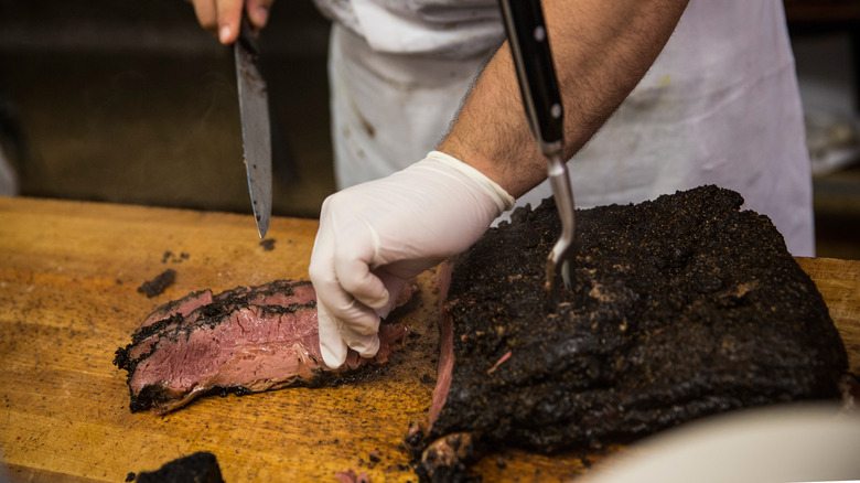 Pastrami being sliced at deli