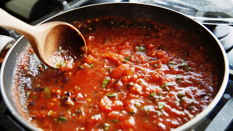 making tomato sauce in pan 