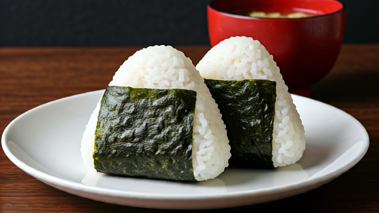 Onigiri on a plate, wrapped in seaweed