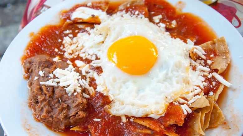 chilaquiles with refried beans and cheese