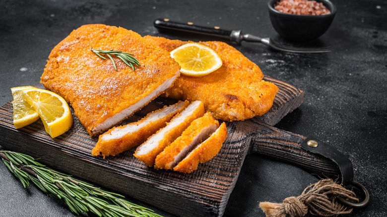 Traditional wiener schnitzel with lemon wedges