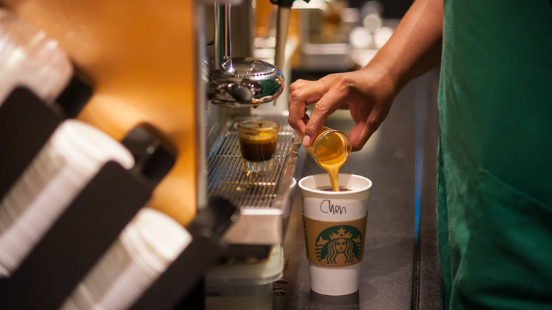 Starbucks barista making a drink
