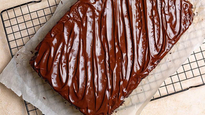 Chocolate sheet cake on cooling rack