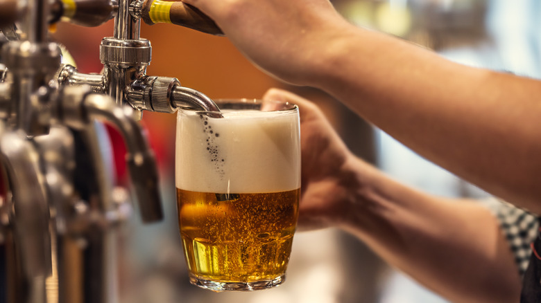 Beer being poured into a mug