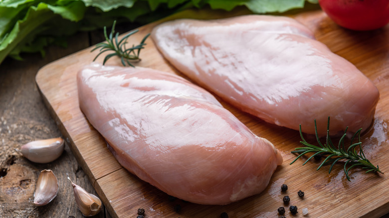 Chicken breasts on cutting board