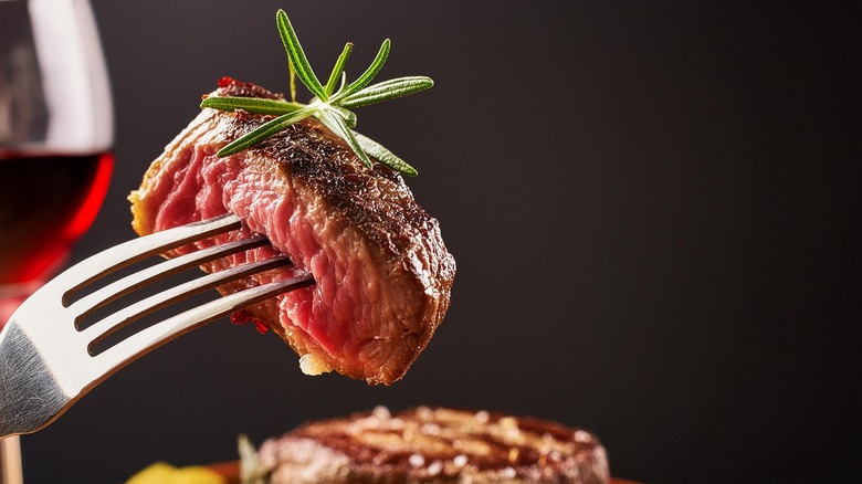 Piece of steak on a fork