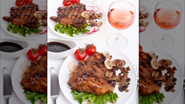 Grilled pork chop with mushrooms and glass of rose wine