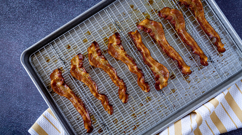 Cooked bacon on wire wrack line sheet pan