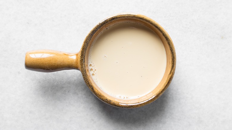 Evaporated milk in ceramic ramekin