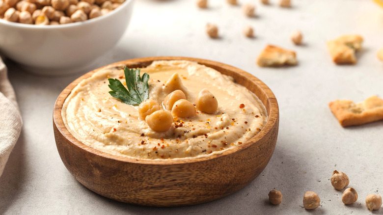 hummus in small wooden bowl