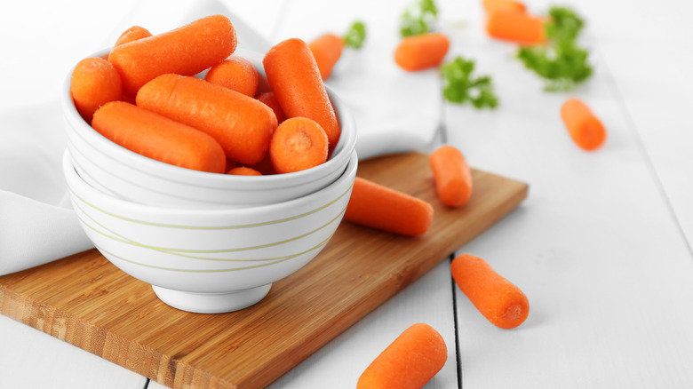 Baby carrots in ceramic bowls