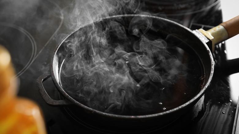 Oil smoking in pan on stovetop