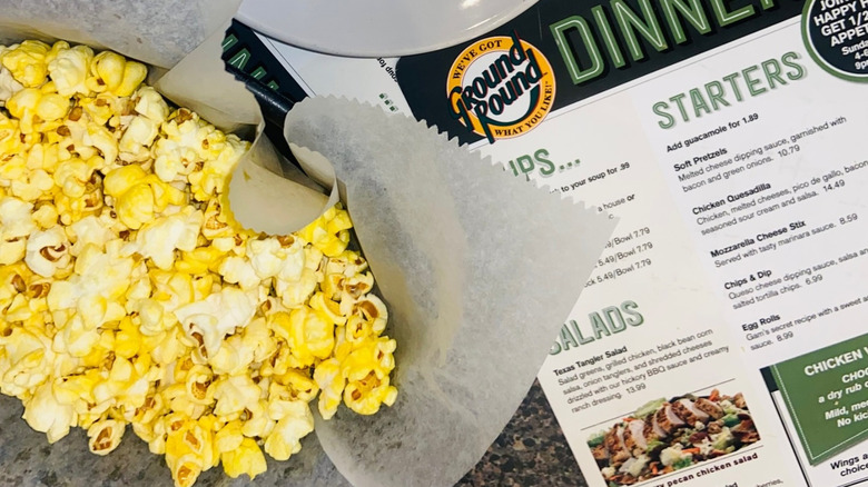 Ground Round menu with basket of popcorn