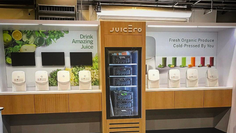 Juicero machine display with refrigerator and branding