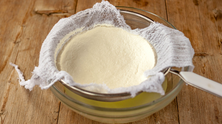 ricotta draining in a colander