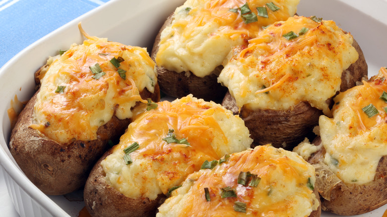 a dish of twice-baked potatoes topped with cheese