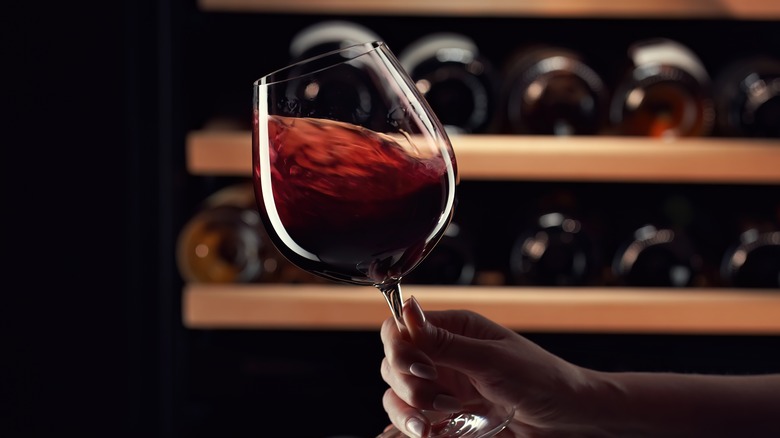 Red wine being swirled in glass