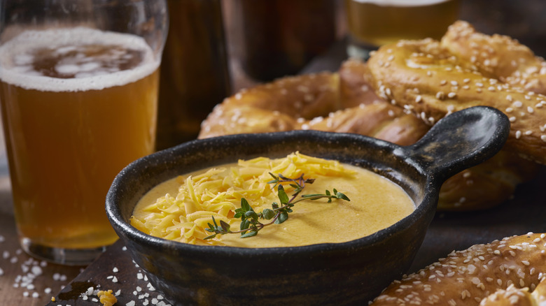 cheese dip, beer and pretzels